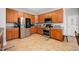 Modern kitchen with stainless steel appliances and wooden cabinets at 104 Full Moon Ct, Garner, NC 27529