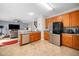 Open kitchen with island, stainless steel appliances, and view of living room at 104 Full Moon Ct, Garner, NC 27529