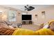 Living room with two brown sofas and a large TV at 104 Full Moon Ct, Garner, NC 27529