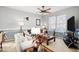 Living room with comfy sofas and large TV at 104 Full Moon Ct, Garner, NC 27529
