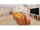 Spacious living room with ceiling fan and large TV at 104 Full Moon Ct, Garner, NC 27529