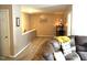Living room with brown leather couches and a TV at 104 Full Moon Ct, Garner, NC 27529