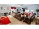 Living room with leather sofas and a red accent rug at 104 Full Moon Ct, Garner, NC 27529