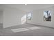 Bright bedroom with carpeted floor and large windows at 281 Logan Creek Dr, Zebulon, NC 27597