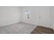 Bright and airy office space with gray carpet and wood-look flooring at 281 Logan Creek Dr, Zebulon, NC 27597