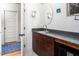 Bathroom with dark wood vanity and granite countertop at 1002 Kenion Rd, Hillsborough, NC 27278