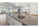 Modern kitchen with stainless steel sink and breakfast bar at 1223 Shaw View Alley # 201, Raleigh, NC 27601