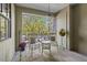 Private patio with chairs, table, and leafy green views at 807 W Trinity Ave # 220, Durham, NC 27701