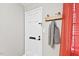 Clean and welcoming entryway with a coat rack and white door at 807 W Trinity Ave # 220, Durham, NC 27701