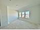 Bright bedroom with triple windows and a view at 109 S Stone Mill W Trl # 238, Clayton, NC 27520