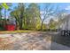 Gravel backyard with shed, and partial view of house at 1201 S Alston Ave, Durham, NC 27701