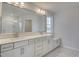 Elegant bathroom with double vanity and built-in bench at 2802 Lacy Holt Rd, Graham, NC 27253