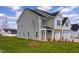 Gray two story house with landscaping and a three-car garage at 2802 Lacy Holt Rd, Graham, NC 27253