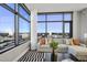 Spacious living room boasts expansive windows offering stunning city views at 122 N Harrington St # 1225, Raleigh, NC 27603