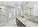 Modern bathroom featuring a walk-in shower and double vanity with marble at 122 N Harrington St # 1225, Raleigh, NC 27603