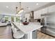 Modern kitchen with white cabinets, large island, and stainless steel appliances at 1227 Shaw View Alley # 201, Raleigh, NC 27601