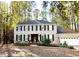 Two-story brick home with shutters, landscaping, and a two-car garage at 404 Annandale Dr, Cary, NC 27511