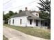 White clapboard house with porch needs some TLC at 313 E Umstead St, Durham, NC 27707