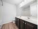 Double vanity bathroom with a tub and hardwood floor at 1103 Kimball Crest Ct, Fuquay Varina, NC 27526