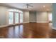 Bright bedroom with hardwood floors and French doors leading outside at 1117 Silver Oaks Ct, Raleigh, NC 27614