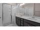 Modern bathroom with double vanity, quartz countertop, and glass shower at 129 Pearl St # 6, Garner, NC 27529