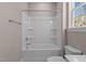Clean bathroom with tub shower combo and shelves at 129 Pearl St # 6, Garner, NC 27529