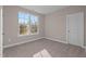 Spacious bedroom with large window and carpet at 129 Pearl St # 6, Garner, NC 27529