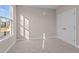 Bright bedroom with large window and carpet flooring at 129 Pearl St # 6, Garner, NC 27529