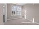 Bright bedroom featuring neutral wall colors and carpet flooring at 129 Pearl St # 6, Garner, NC 27529