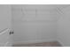 Walk-in closet with wire shelving providing ample storage space at 129 Pearl St # 6, Garner, NC 27529