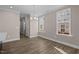 Bright dining room with hardwood floors and large windows at 129 Pearl St # 6, Garner, NC 27529