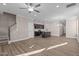 Open concept kitchen with island, dark cabinetry, and stainless steel appliances at 129 Pearl St # 6, Garner, NC 27529