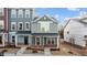 Newly built townhouse exterior with brick and siding at 129 Pearl St # 6, Garner, NC 27529