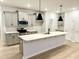 Modern kitchen featuring an island, stainless steel appliances, and light cabinets at 20 Nettle Ln # 239, Clayton, NC 27520