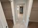 Clean bathroom hallway with closets and marble-tiled flooring at 445 Edison Rail Ln, Knightdale, NC 27545