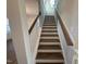 Elegant staircase with wood treads and white railing at 445 Edison Rail Ln, Knightdale, NC 27545