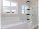 Bathroom featuring a soaking tub, glass shower, and modern fixtures at 6040 Scalybark Road, Durham, NC 27712