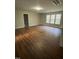 Large bonus room with wood flooring and window views at 80 Cricketwood Ln, Youngsville, NC 27596