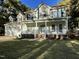 Two-story house with a large front porch, attached two-car garage, and well-manicured lawn at 80 Cricketwood Ln, Youngsville, NC 27596