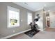 Exercise room with Peloton bike and window views at 8409 Tadmore Ln, Knightdale, NC 27545