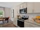Modern kitchen with stainless steel appliances and granite countertops at 246 Moore Creek Dr, Fuquay Varina, NC 27526