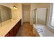 Spacious bathroom with double sinks, shower, and bathtub at 202 Beckingham Loop, Cary, NC 27519