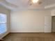 Main bedroom featuring a large window, neutral walls, and carpet at 202 Beckingham Loop, Cary, NC 27519