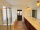 Spa-like bathroom featuring a soaking tub and double vanity at 202 Beckingham Loop, Cary, NC 27519