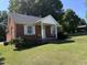 Brick ranch house with a covered porch at 2222 Sunset Hills Dr, Burlington, NC 27215