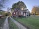Brick ranch house with a covered porch, another view at 2222 Sunset Hills Dr, Burlington, NC 27215