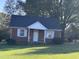 Brick ranch home with a covered porch and large yard at 2222 Sunset Hills Dr, Burlington, NC 27215
