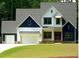 Two-story farmhouse with white siding and blue accents at 4332 Coldwater Springs Dr, Raleigh, NC 27616