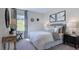 Well-lit bedroom with a king-size bed and stylish decor at 909 Delano Dr, Knightdale, NC 27545