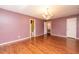 Spacious bedroom with hardwood floors and a private bathroom at 1 Westbury Pl, Durham, NC 27707